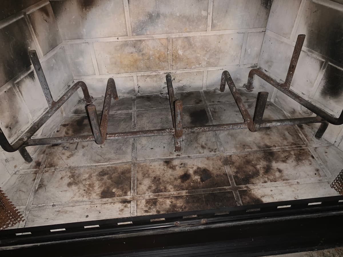 The same fireplace after soot and creosote were vacuumed out