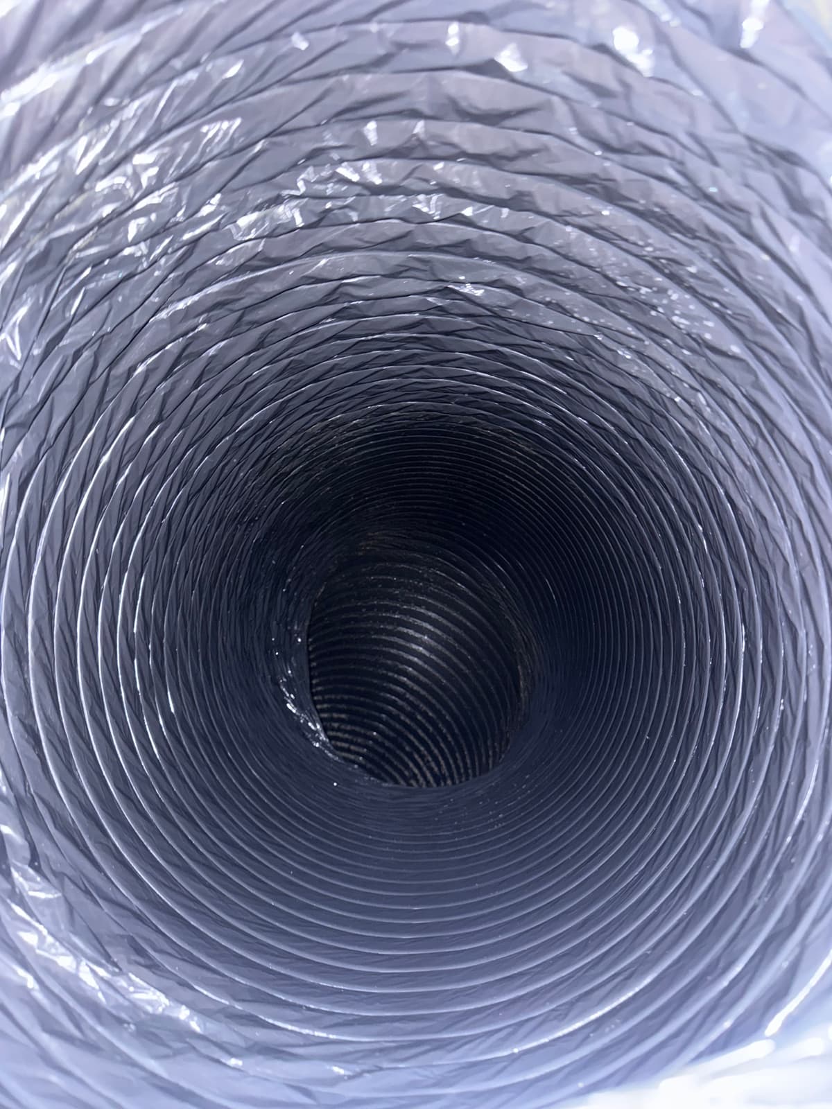 The same flexible duct after cleaning, with a clean liner