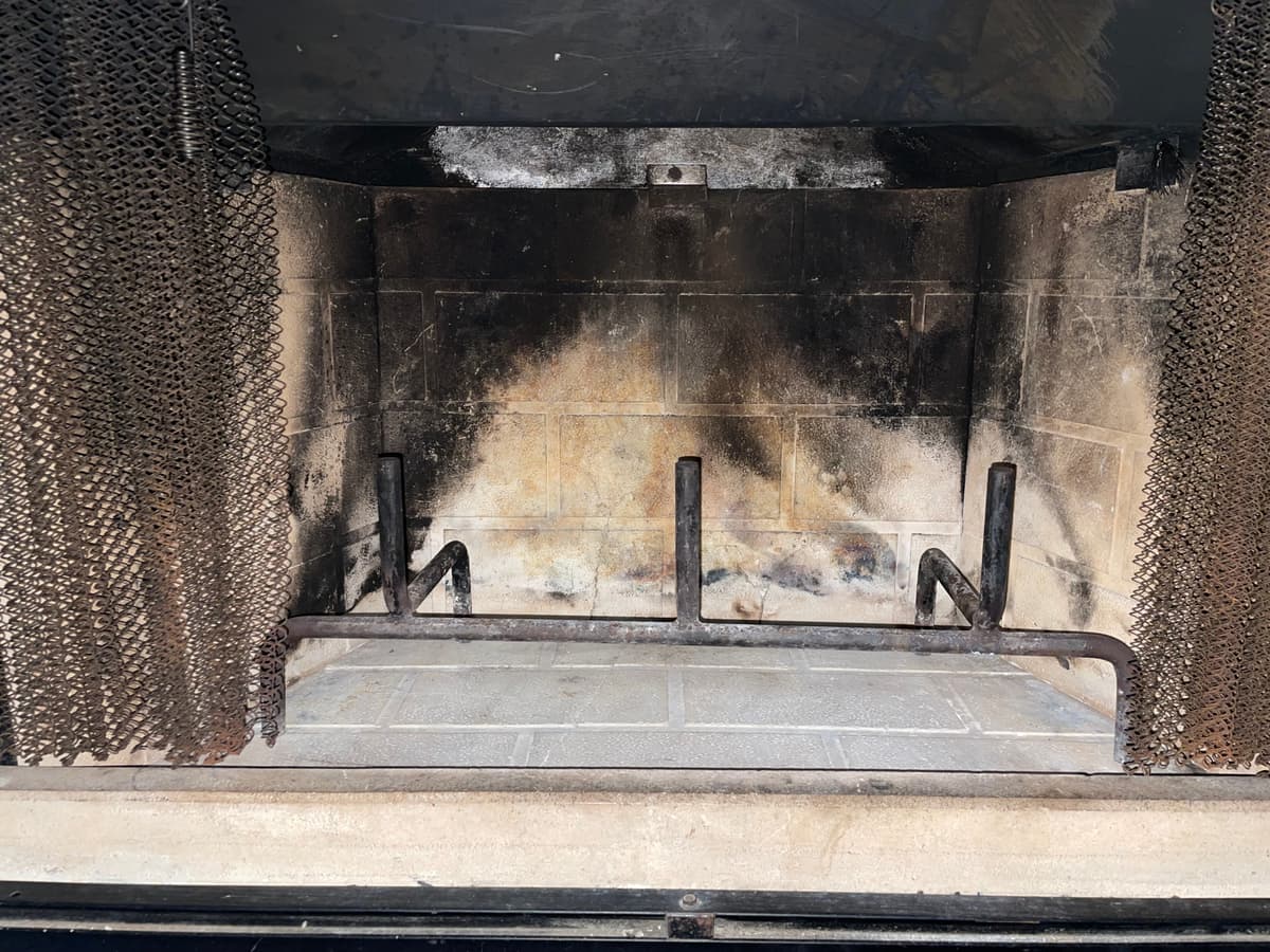 The same fireplace cleaned and ready for a fire