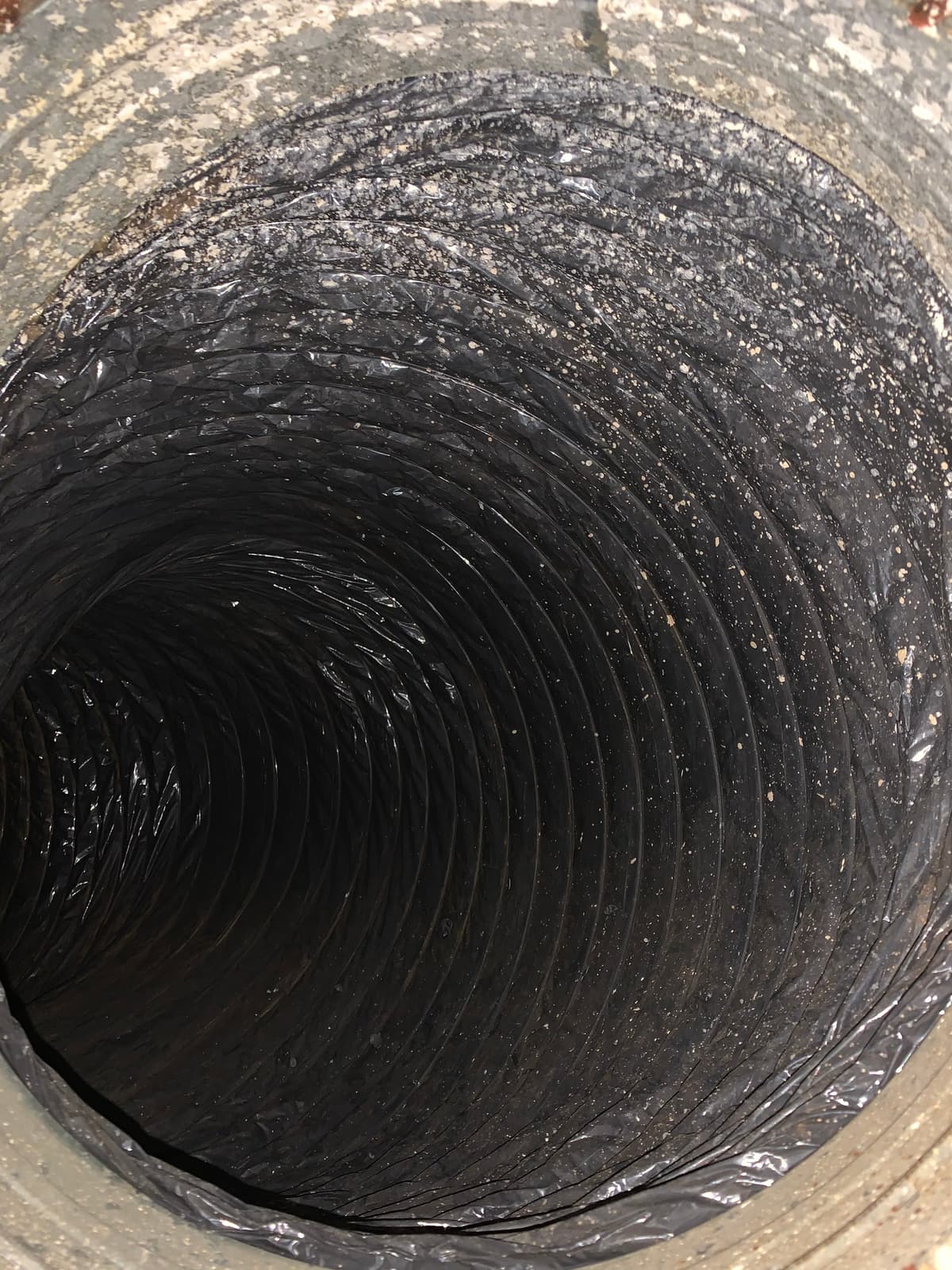 The same duct after cleaning, with a clean dark liner