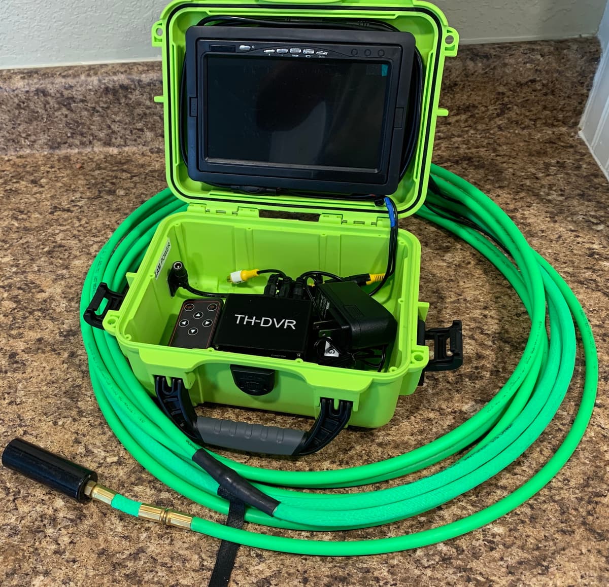 A duct inspection camera and monitor in its carrying case