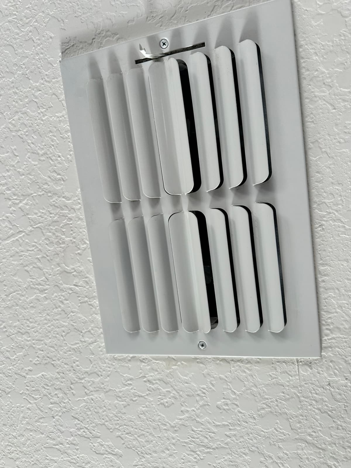 A ceiling supply register after cleaning, free of dust