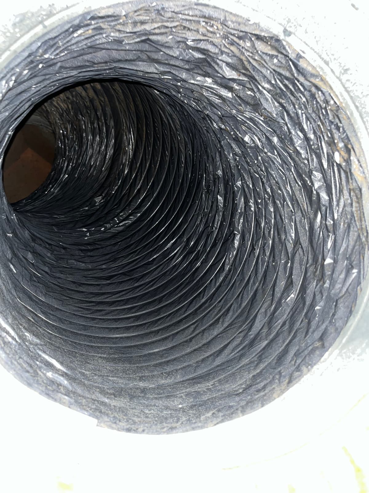 The same flexible duct after cleaning, with its liner visible again