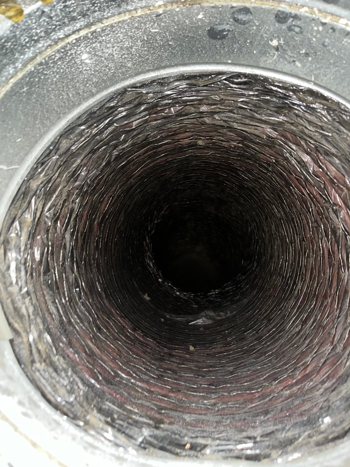 The same duct after cleaning, its liner clear of dust