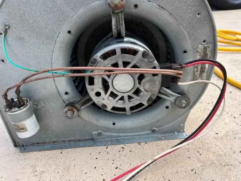 The same blower wheel after cleaning, blades back to bare metal