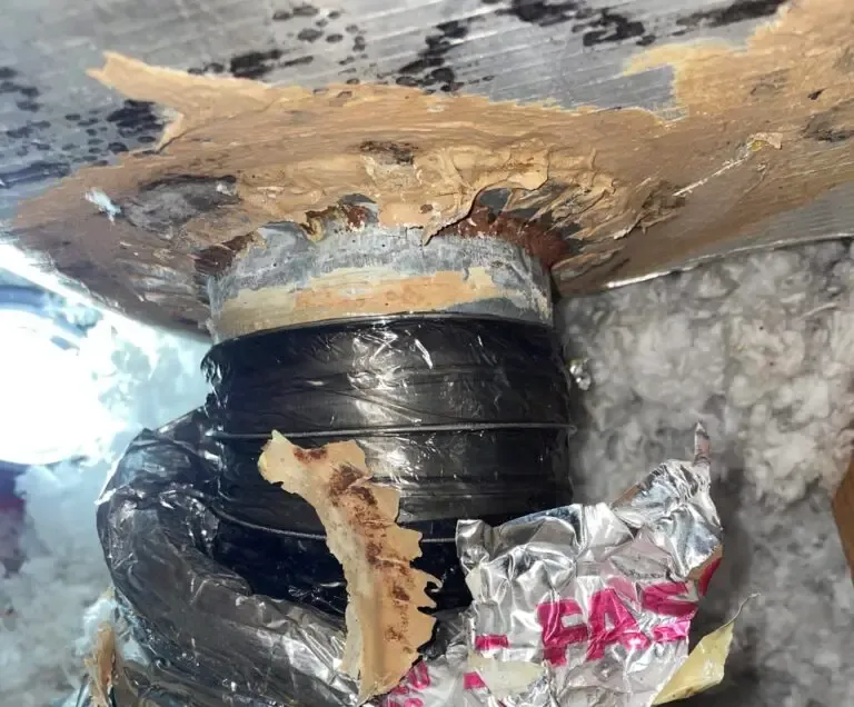 A leaking duct connection at the plenum before it was sealed