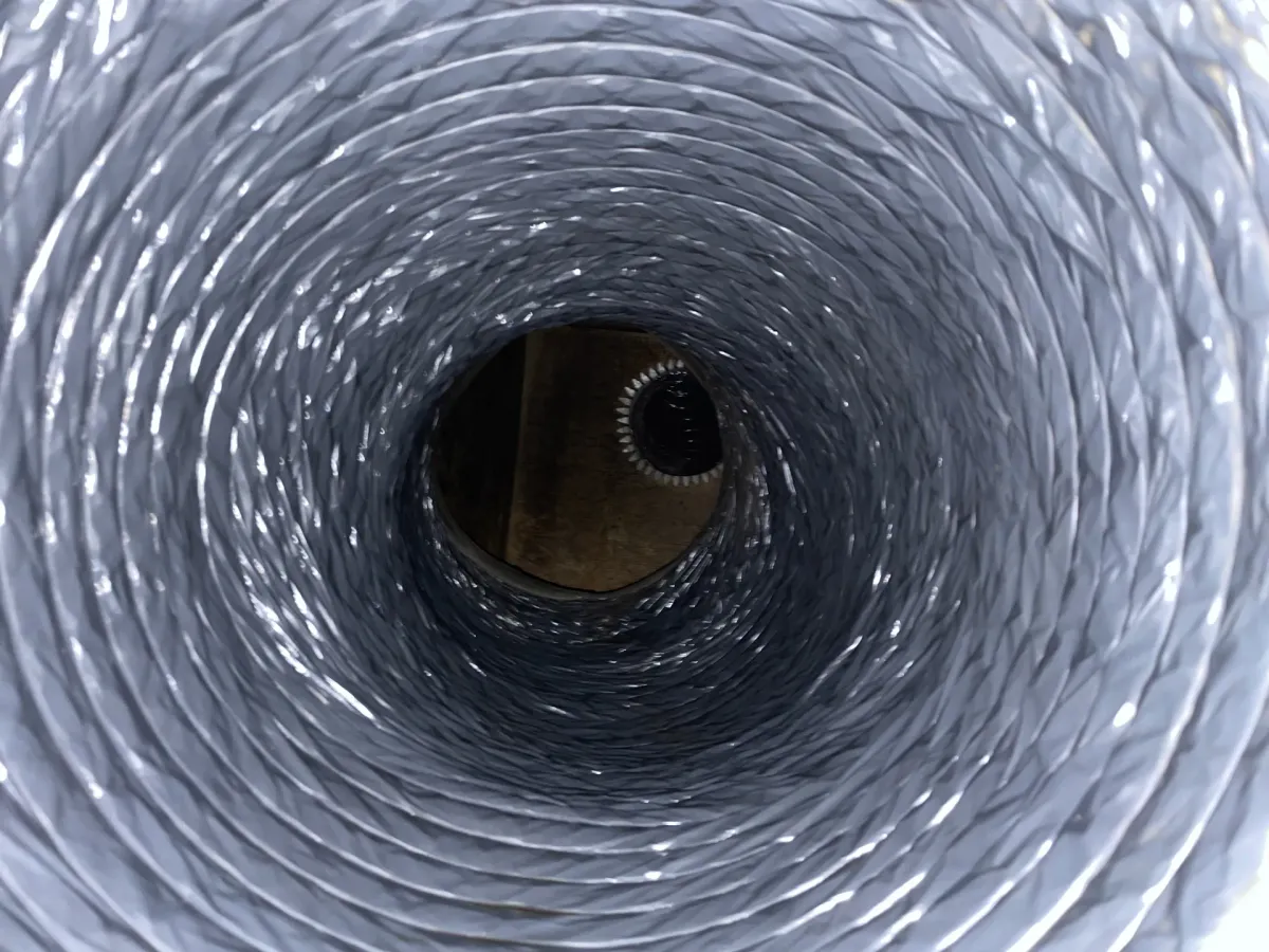 A cleaned commercial duct run, the liner back to a bare surface along its full length