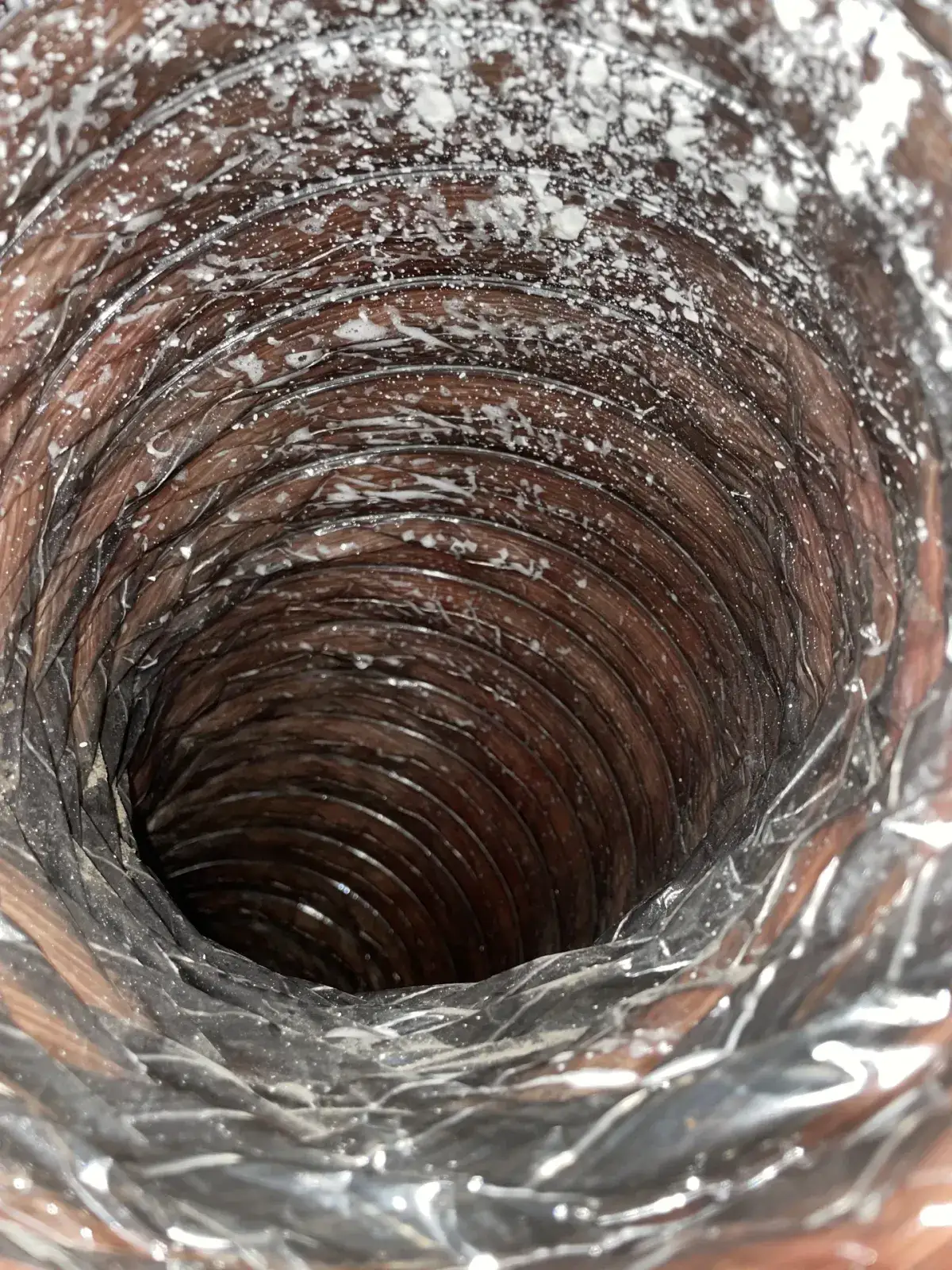 A clean duct run seen deep into the house