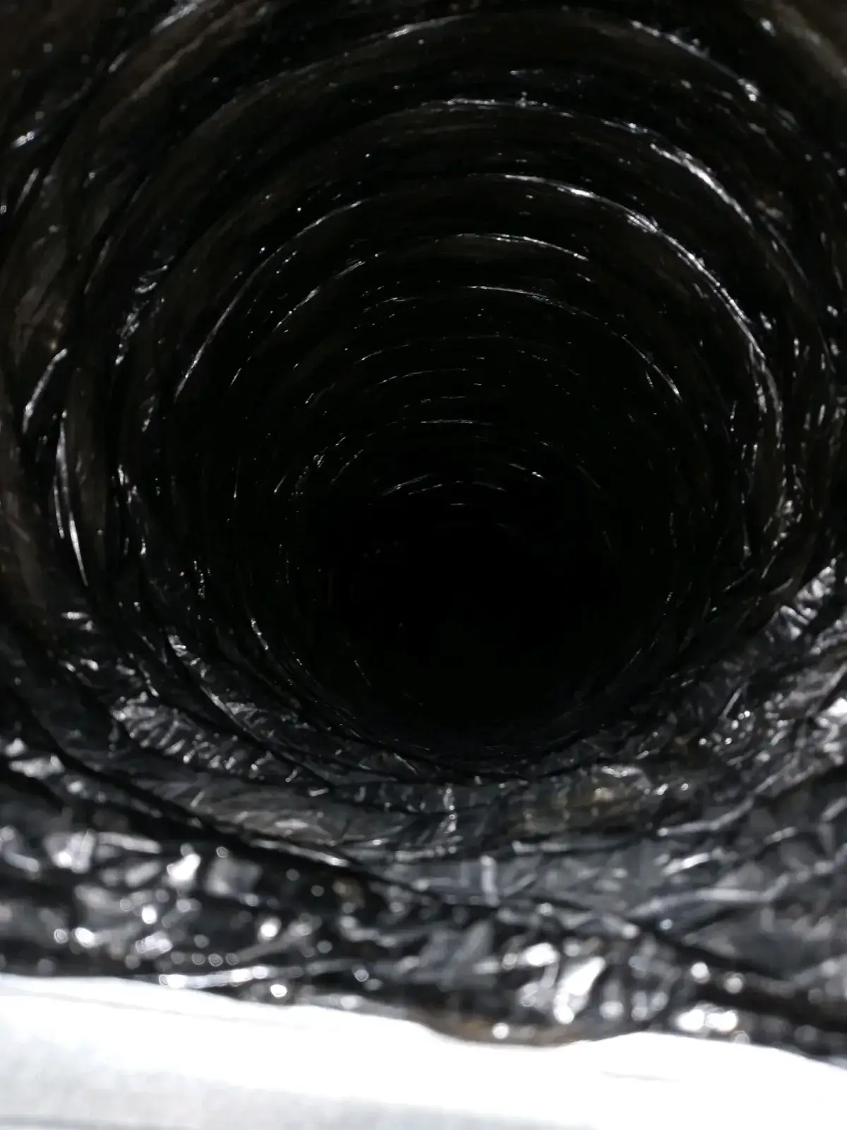 A clean duct liner catching the light after cleaning