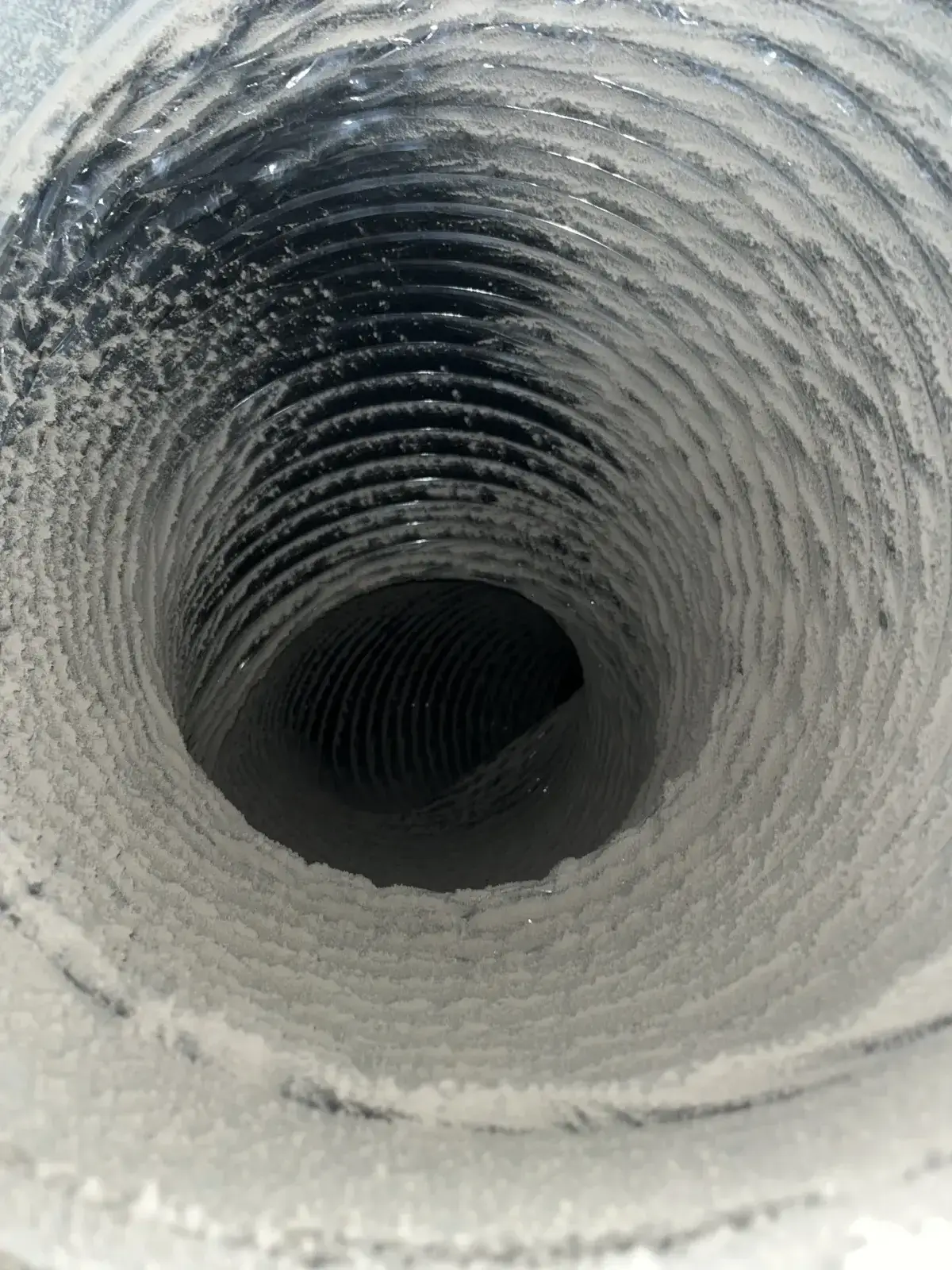 The clean spiral liner of a duct after cleaning