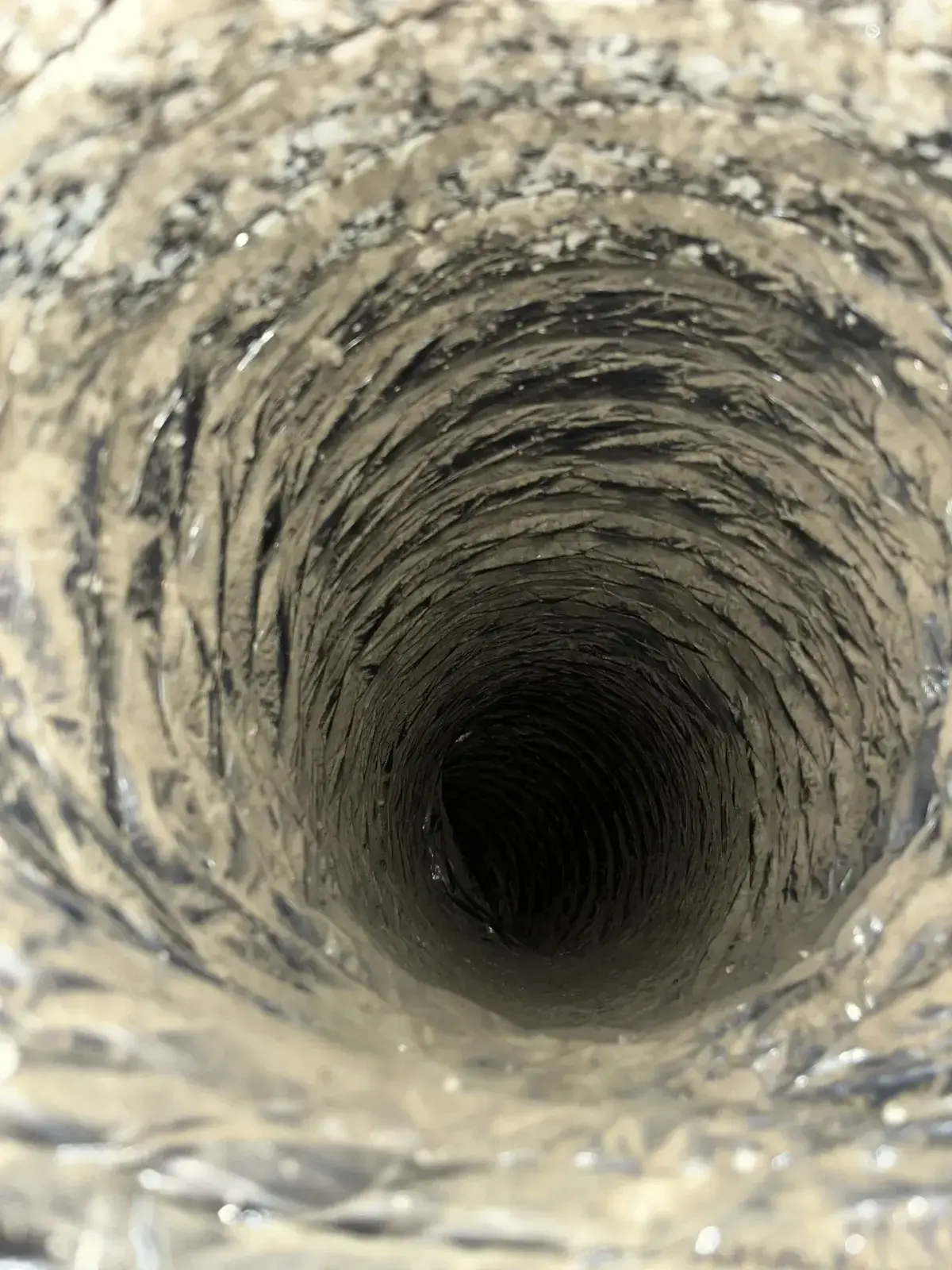Dust deep inside a duct run before cleaning