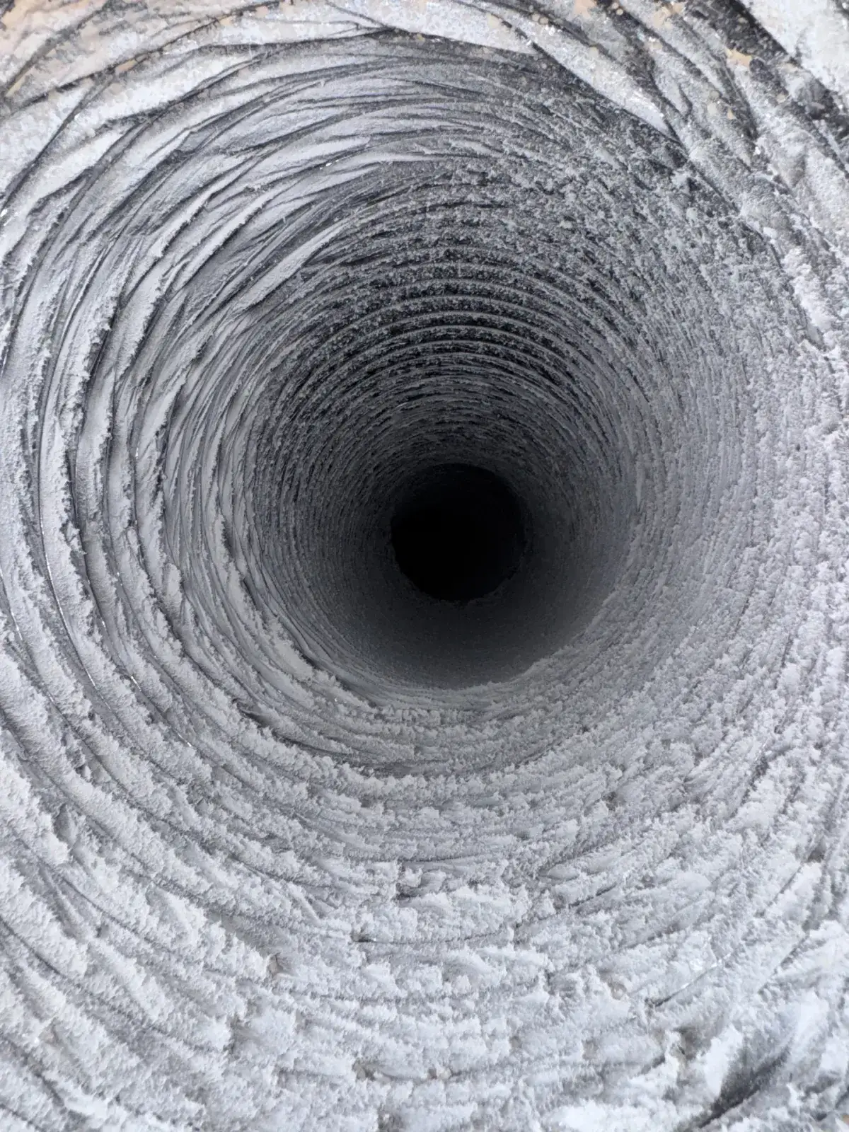 Grey buildup inside a residential supply duct