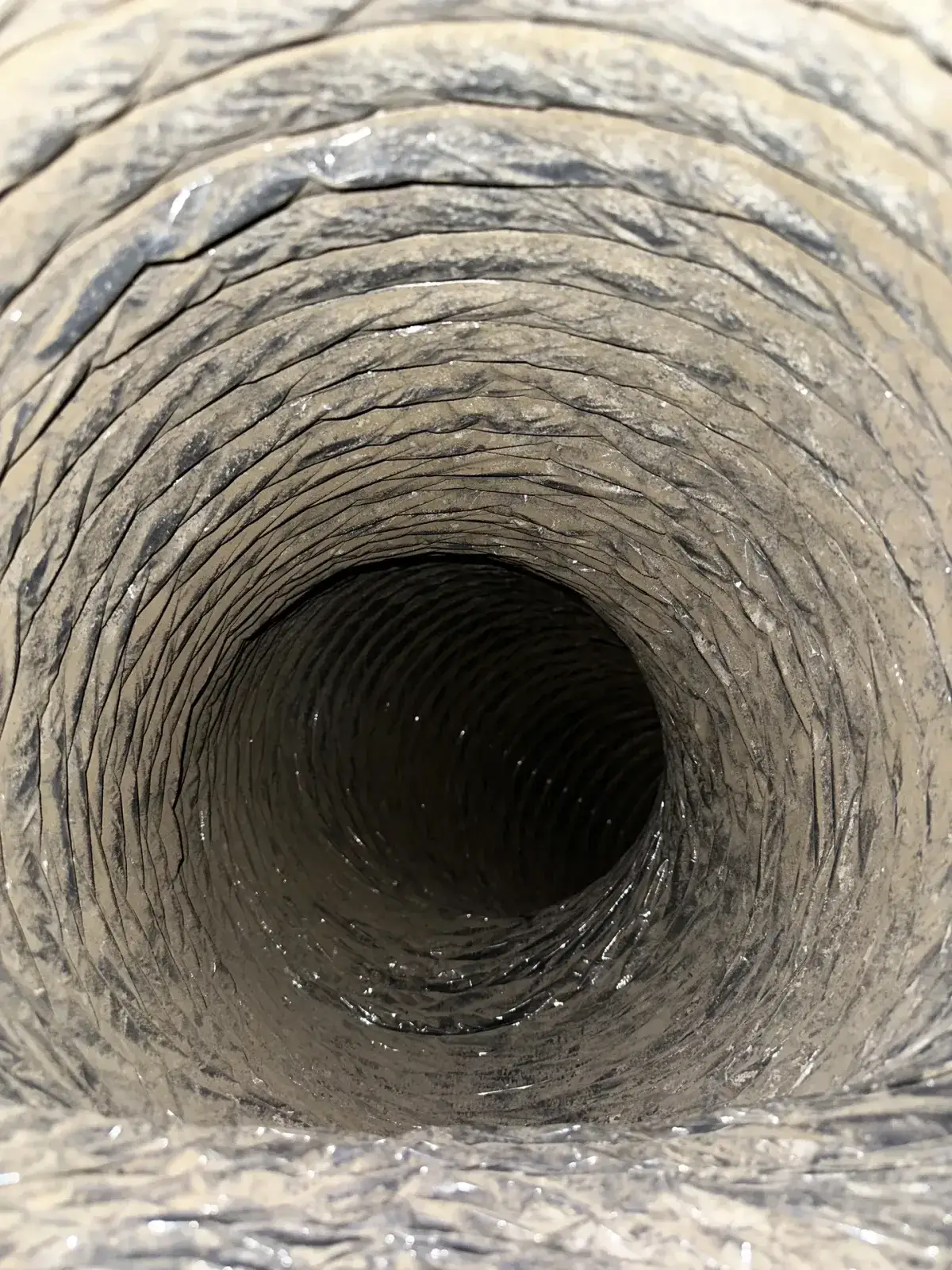 Dust along a long duct run before cleaning