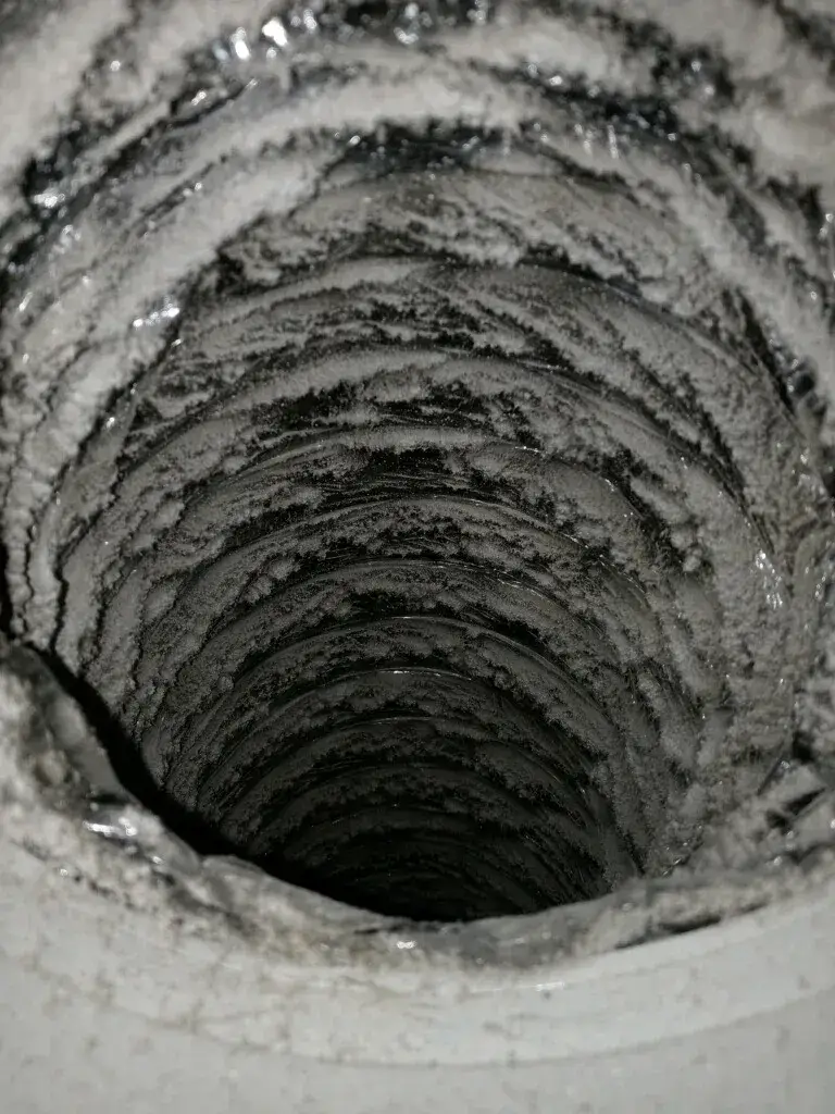 Thick dust inside a duct before cleaning
