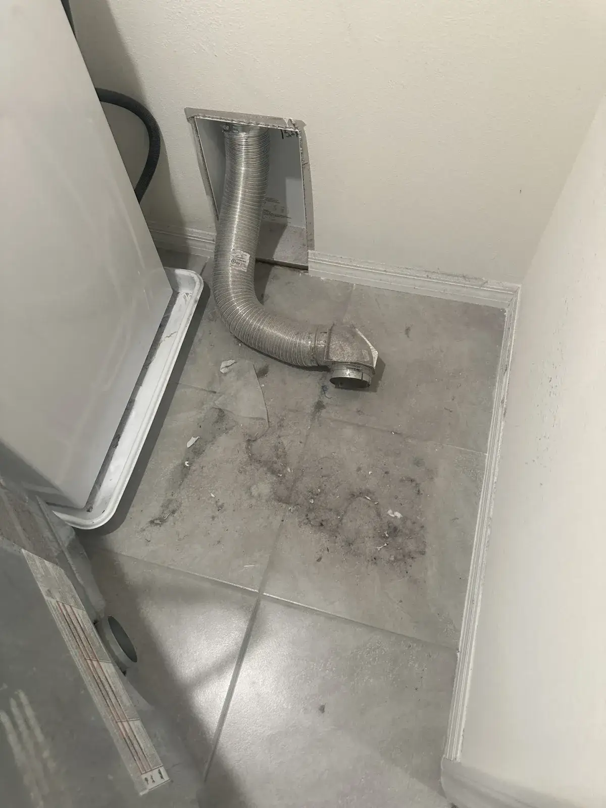 A dryer vent run through an attic space