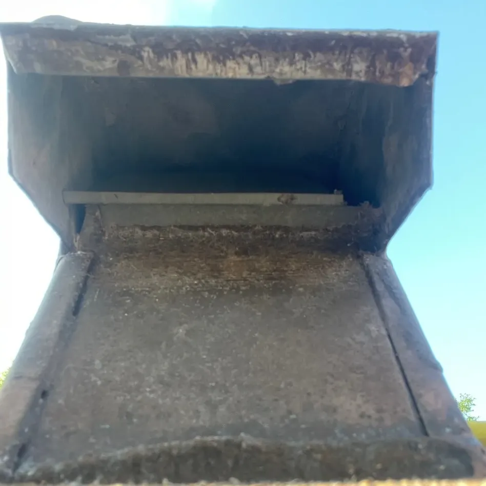 The same roof dryer vent cap cleared of lint after cleaning