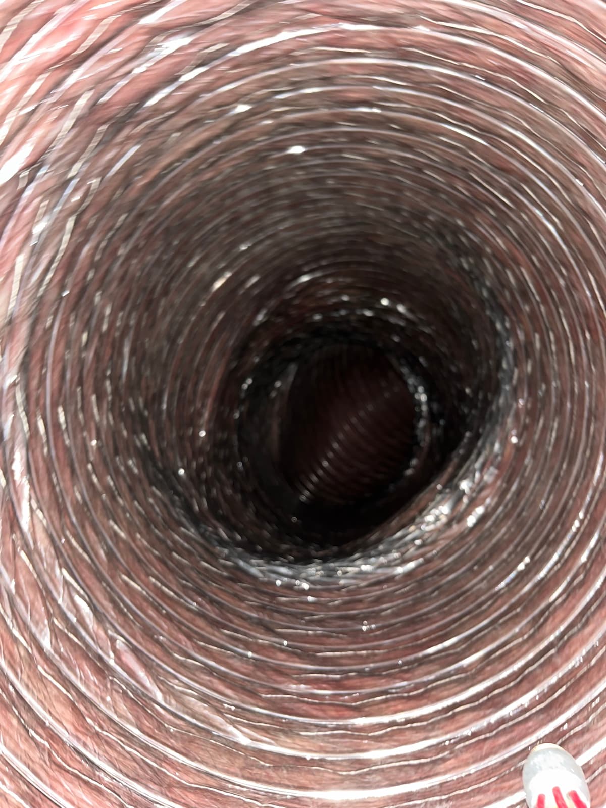 The same duct after cleaning, with its liner exposed