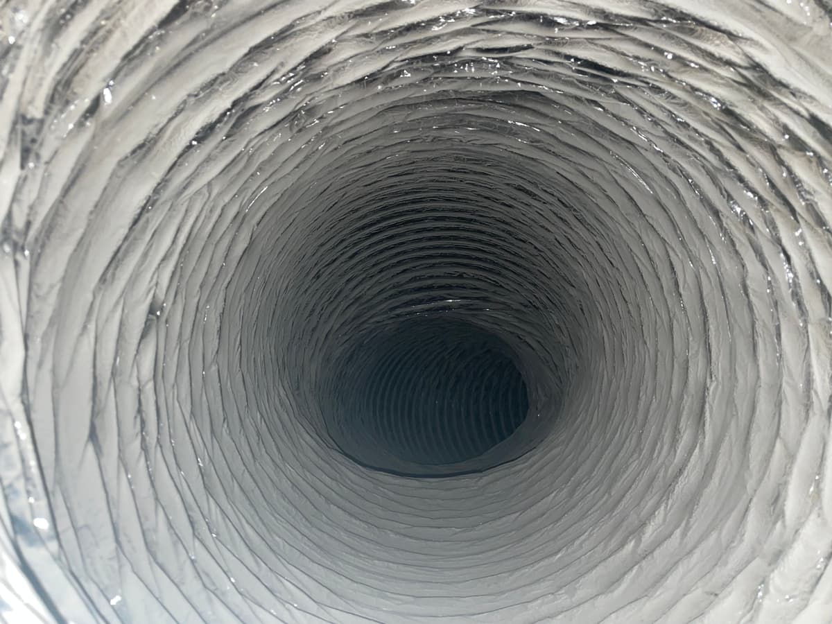 A dusty air conditioning duct before cleaning