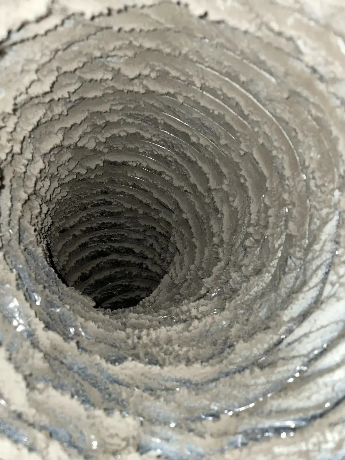 A pale, clean duct interior after cleaning