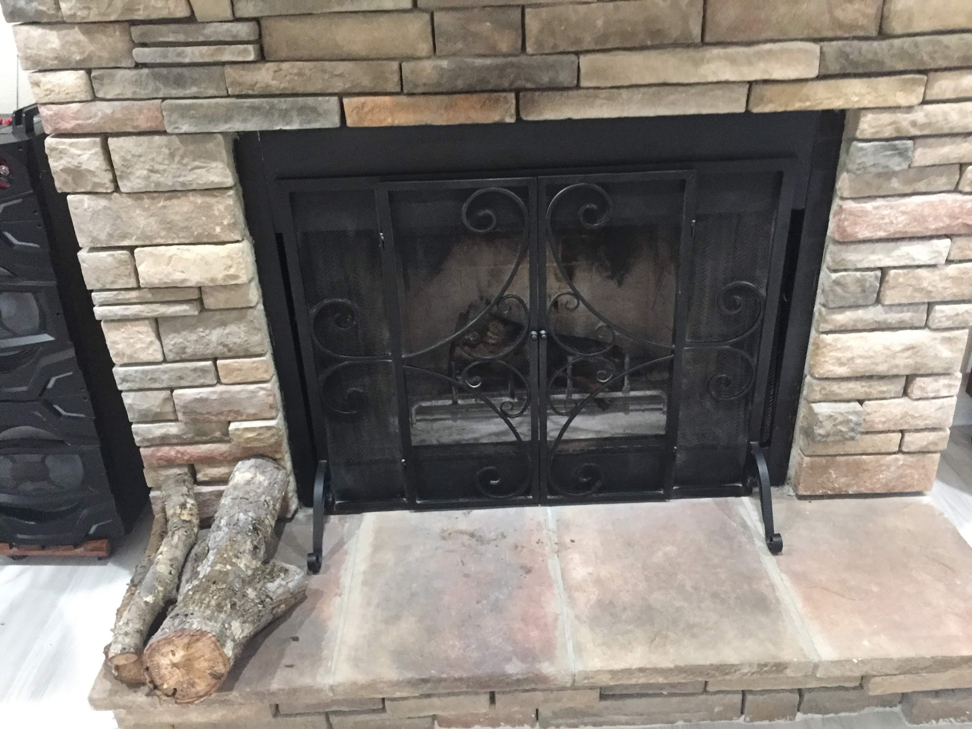 The same fireplace clean and ready for use after a professional sweep