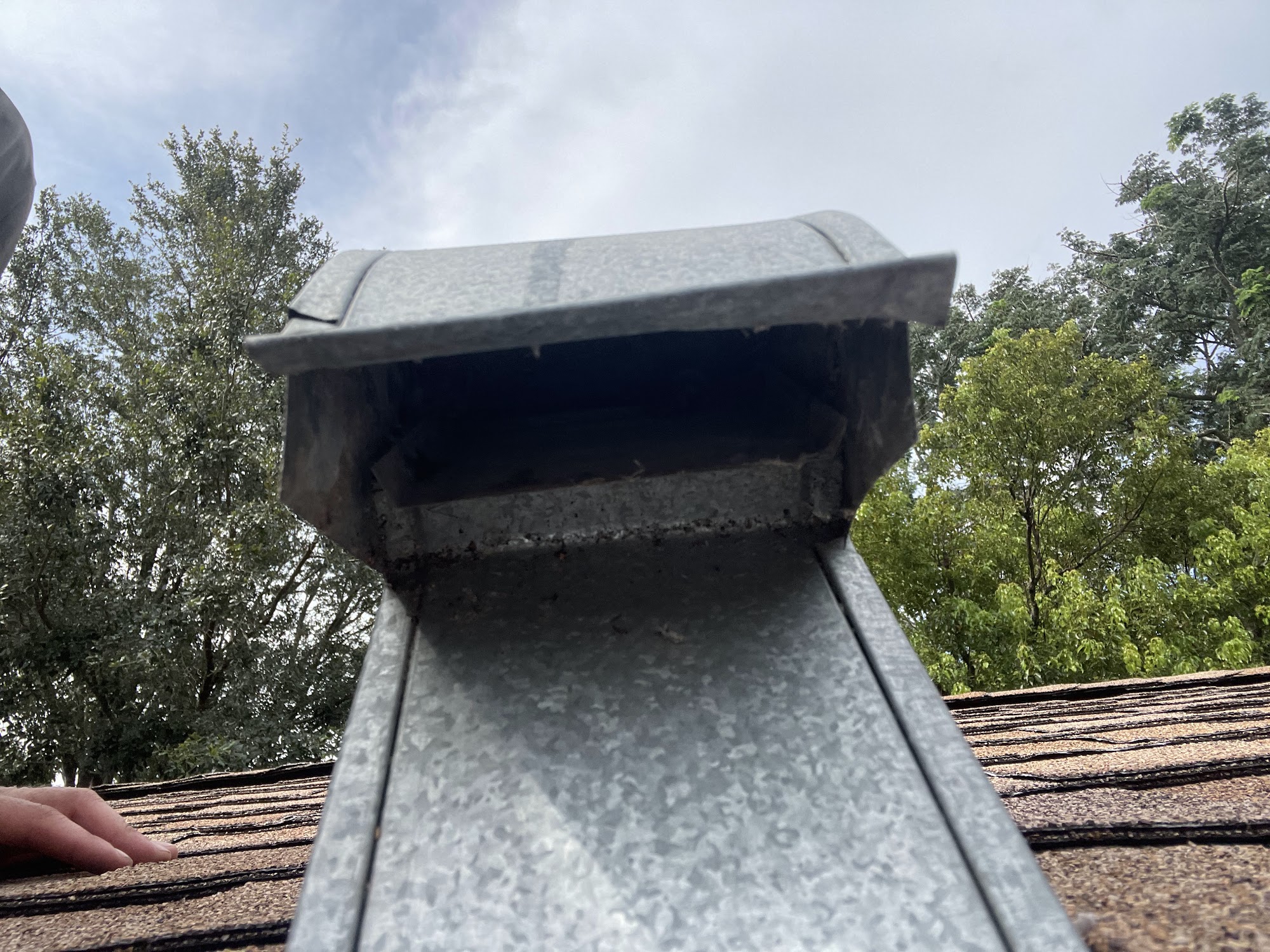 The same roof dryer vent cap clear and venting freely after cleaning