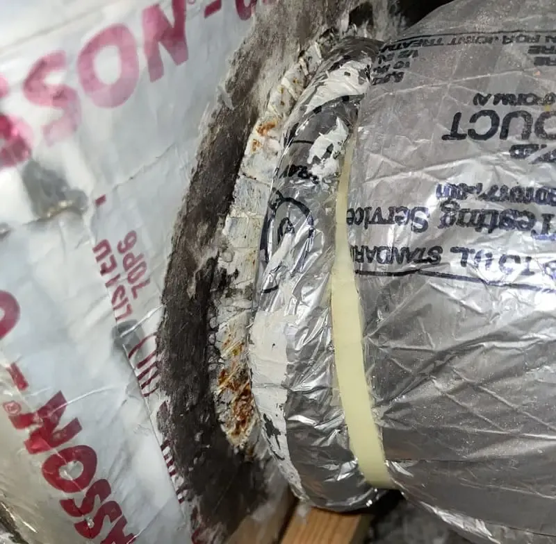 A return air grille removed from the wall during cleaning